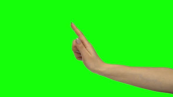 Arm of Woman Is Gesturing Stop. Green Screen. Close Up