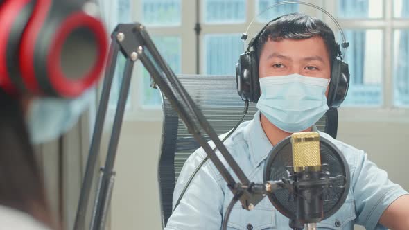 Over Shoulder View Of Kid Girl Interview Young Boy Guest Wearing Protect Mask In Podcast Studio