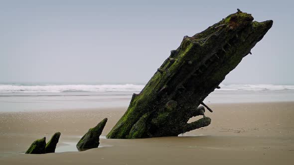 Old Shipwreck Sticking Out Of The Sand