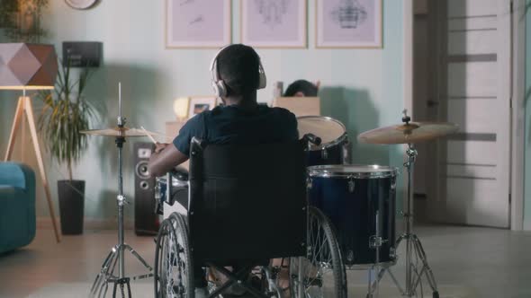 Unrecognizable Handicapped Drummer in Home Studio