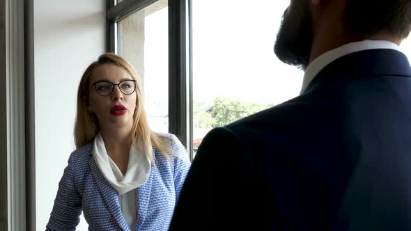 Successful Hard Working Businesswoman Is Talking with Her Colleague