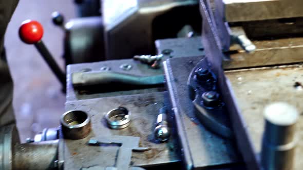 Metallic lathe working at factory. Operator machining part by cnc turning machine