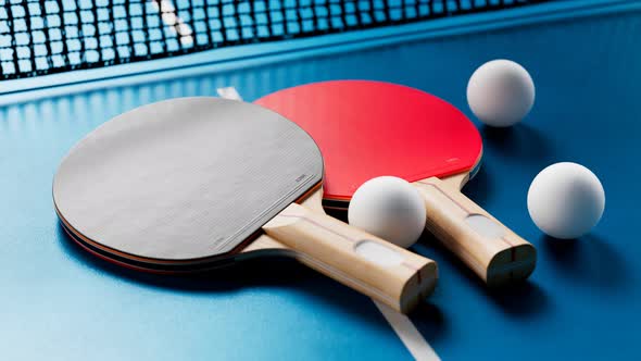 The camera is tilting up the table tennis set. Ping pong balls, paddles and net.