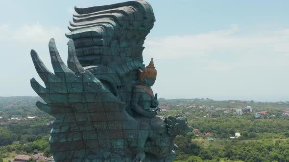 Side Dolly Aerial View of Giant Garuda Wisnu Kencana Statue in Bali Indonesia