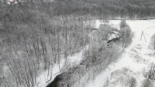 Gorgeous Winter Landscape with a Small River Aerial View