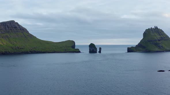 Drone Towards Drangarnir Sea Stacks In Faroe Islands