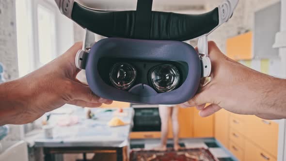 POV Man Putting on VR Helmet at Home Kitchen