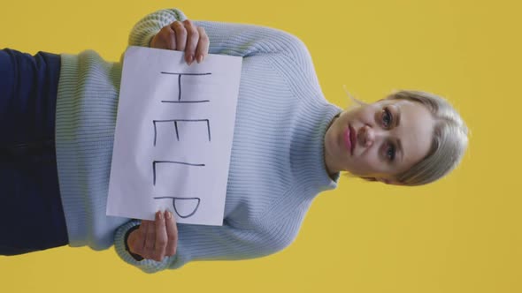 Woman Holding Help Sign