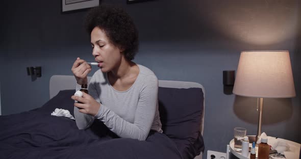 African American Woman Taking Medication