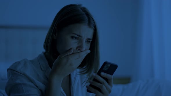 Sleepless Woman Reads Bad News on Phone Feeling Worried