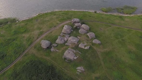 Aerial view of Huge stones (rocks) in a field near the lake 10