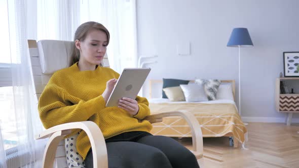 Shocked Stunned Woman Using Tablet for Browsing