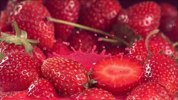 Strawberry Falling in Juice Between Strawberries