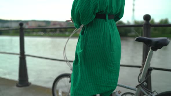 Girl walking with a bike