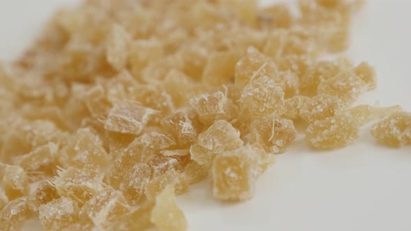 Pile of Candied ginger root on the table  close-up slow tilt 4K 2160p 30fps UltraHD footage - Crysta