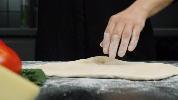 Chef is cooking italian pizza
