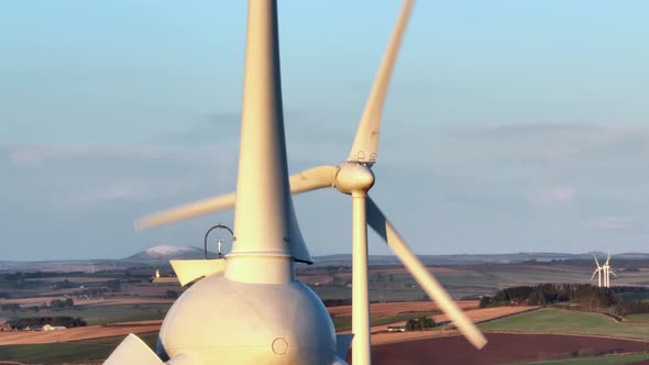 Wind Turbines at Sunset Generating Renewable Energy