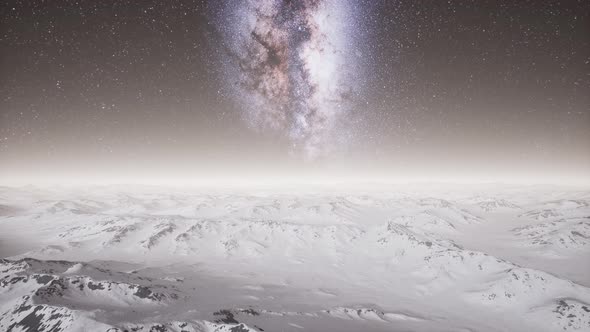 Milky Way Above Snow Covered Terrain alt