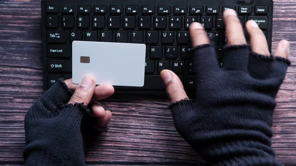 Hacker Hand Stealing Data From Credit Card 