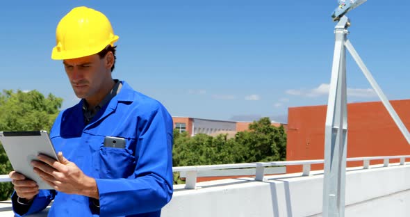 Male worker working at solar station