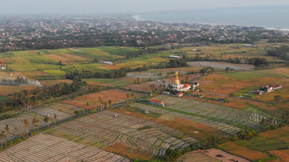 Aerial Flying Video of Balinese Temple Among Rice Fields, Tropical Island of Bali, Beautiful Temple