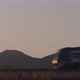 Train passing by mountains Cinematic shot with Sunset and Countryside - VideoHive Item for Sale