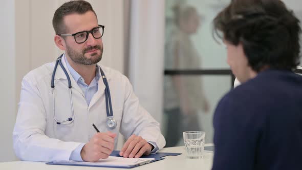 Male Doctor Doing Consultation with Patient