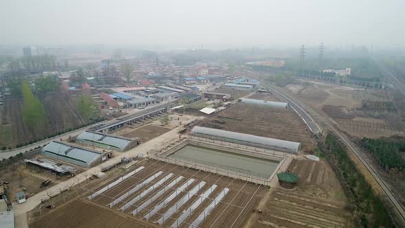 Rural Poor Village Outside Beijing with Farmland and Train Tracks During Extreme Pollution Day