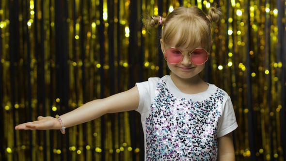 Child Showing Side Advertising Area. Looking Shocked, Pointing at Your Promotional Text, Logo