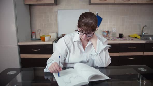 Woman Preparing for the Exam, Reading Business Literature