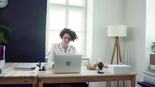 Young beautiful young woman working from home