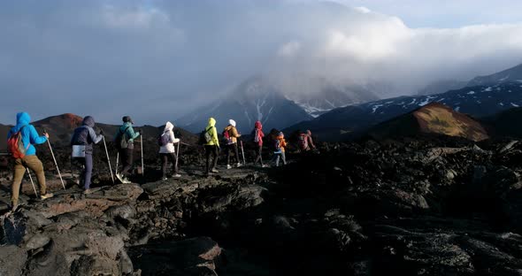 trekking along the lava field to the volcano