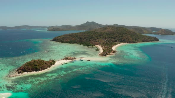 Small Torpic Island with a White Sandy Beach, Top View.