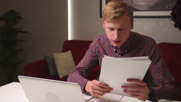 Serious Young Businessman Has Conference Video Calling By Webcam Working with Papers Focused Student