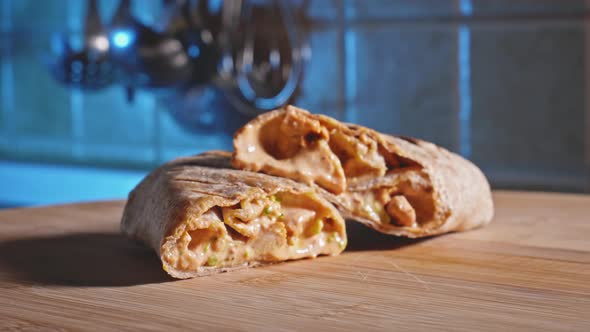 Close Up Of Low-Calorie Tortilla Wrap With Chicken Breast Ready To Eat. rack focus