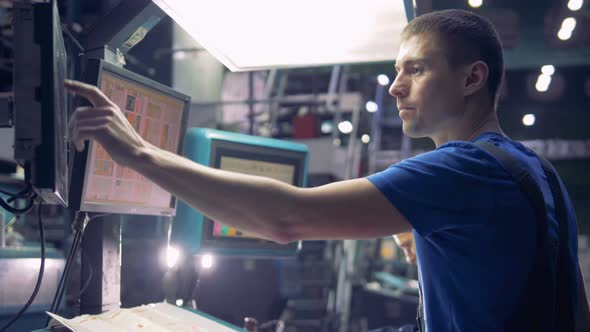 Person Working with a Printing Machine, Close Up.