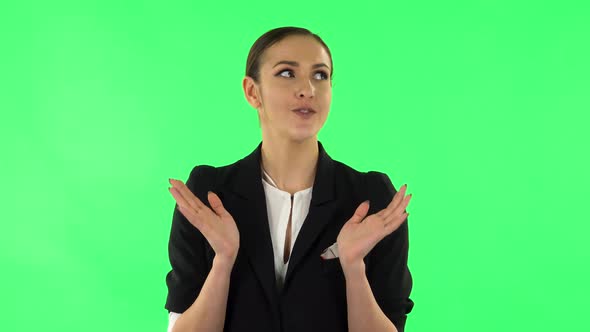 Beautiful Girl Is Reporting and Tells a Lot of Interesting Informations. Green Screen