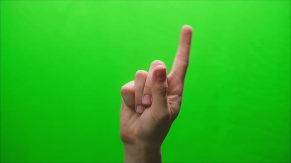 Closeup of a Hand Gesture on a Green Background Shooting a Gesturing in Studio Shaking Finger at