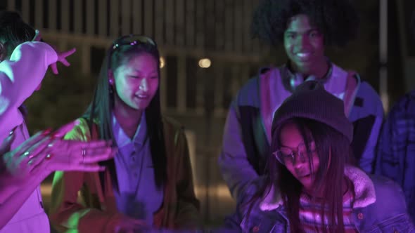 Young Cool African American Woman Dancing with Friends at Street Party Having Fun in a Crazy