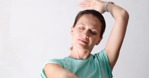 Young Woman with Closed Eyes Dancing Slowly on White Background  Movie