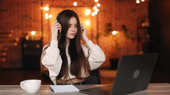 A Woman is Sitting in Her Home Office