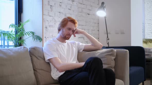 Casual Man Sleeping While Sitting on Sofa