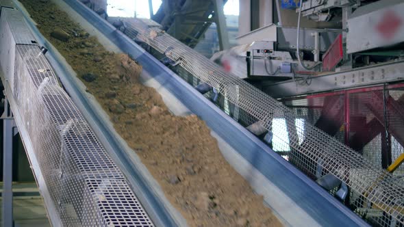 Conveyor Duct with Construction Materials Moving Along It