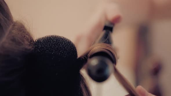 Stylist Is Making a Hairstyle for a Young Girl