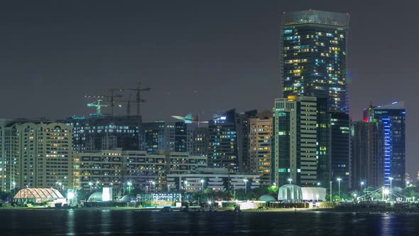 Panorama View of Abu Dhabi Skyline and Seafront at Night Timelapse United Arab Emirates