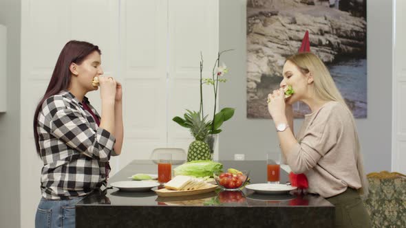 Girls eating sandwiches