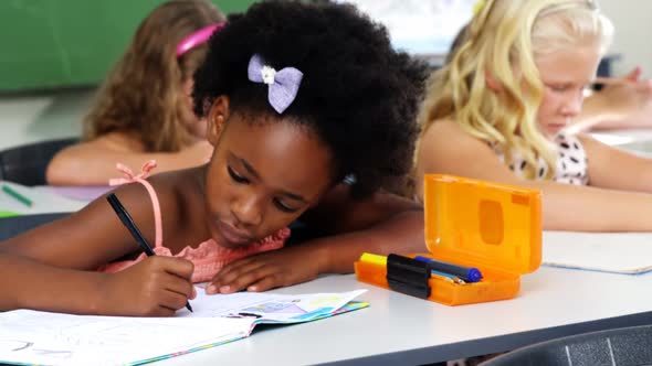 School kids doing homework in classroom