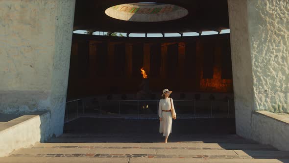 Young woman leaving the pantheon on Mamayev Kurgan, Volgograd