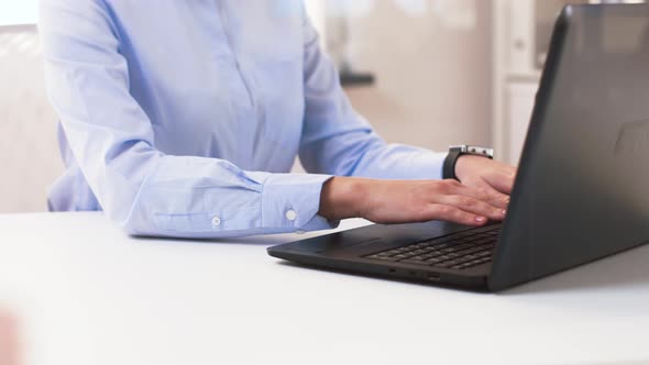Businesswoman Hands Typing on Laptop at Office
