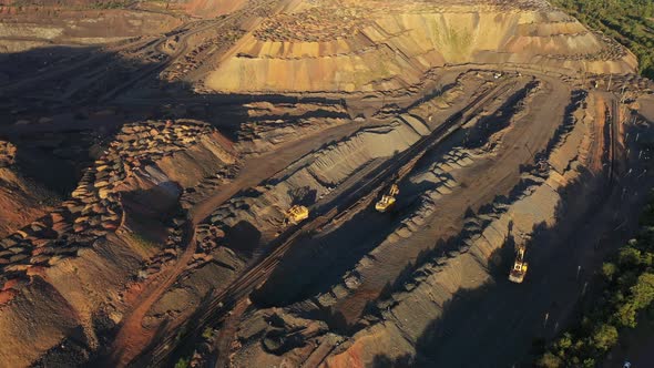 Heavy Mining Machinery in a Quarry Aerial Evening View